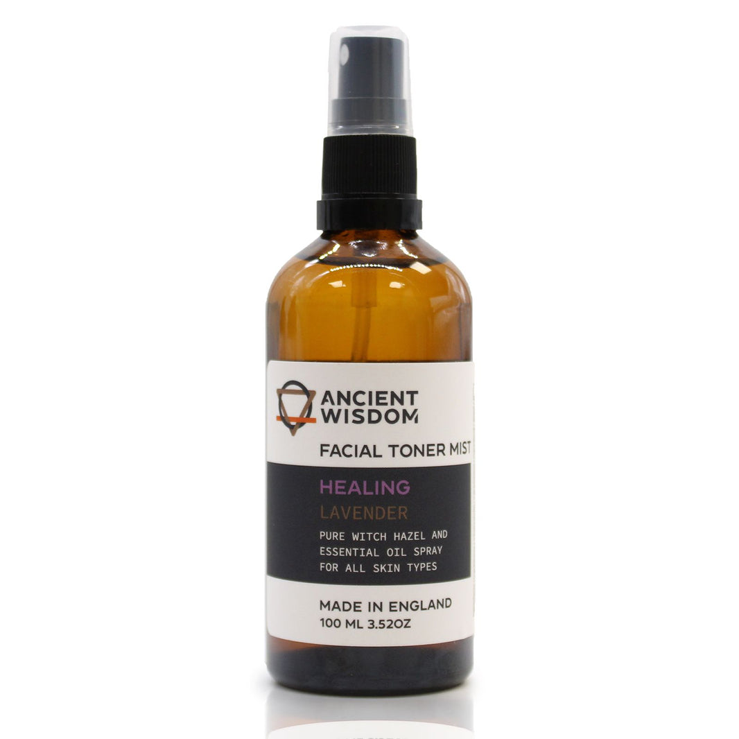 A 100ml amber spray bottle of Witch Hazel and Lavender facial toner with a white and gold apothecary-style label.