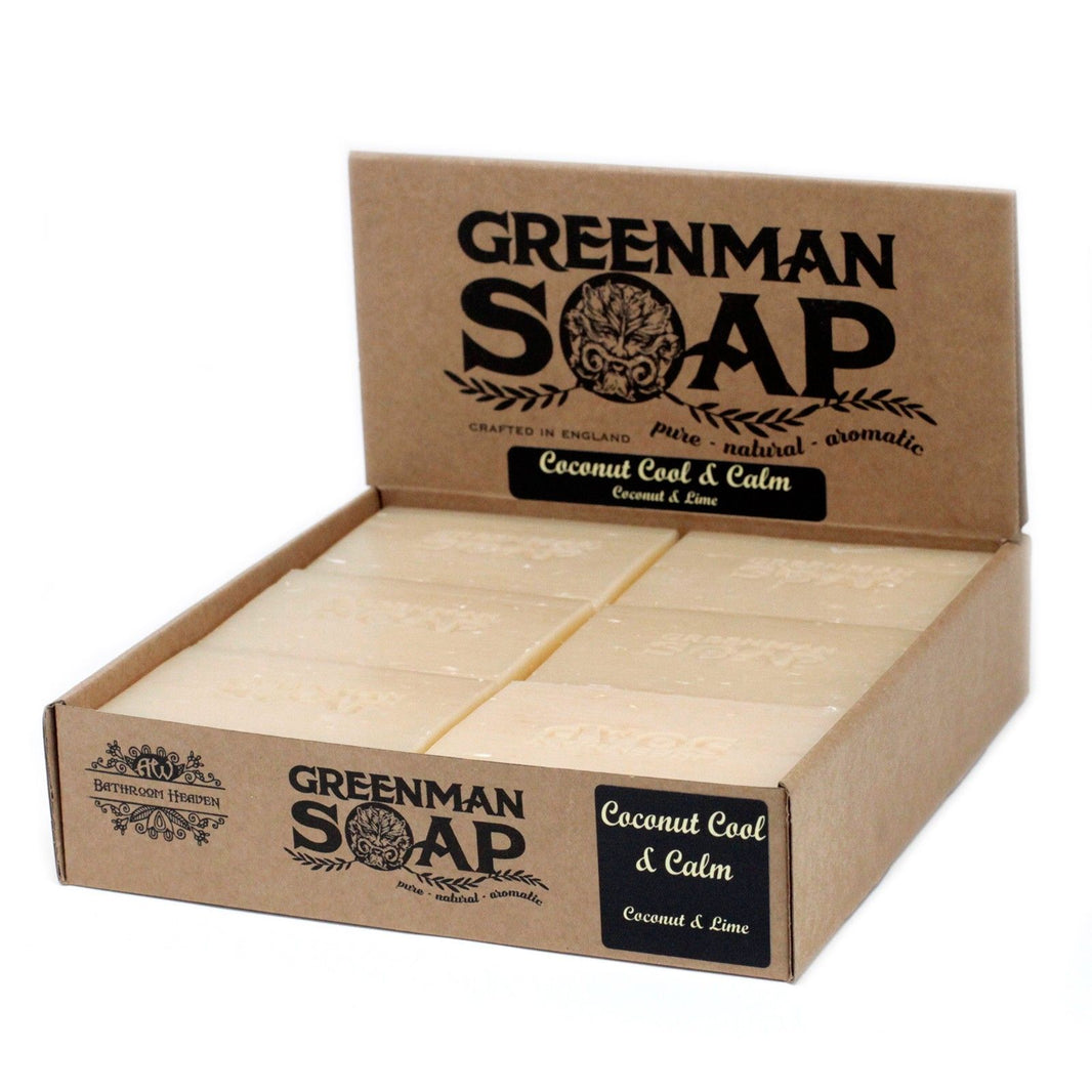 A 100g white and tan artisan Greenman soap bar with a tropical coconut scent and rustic wrap.