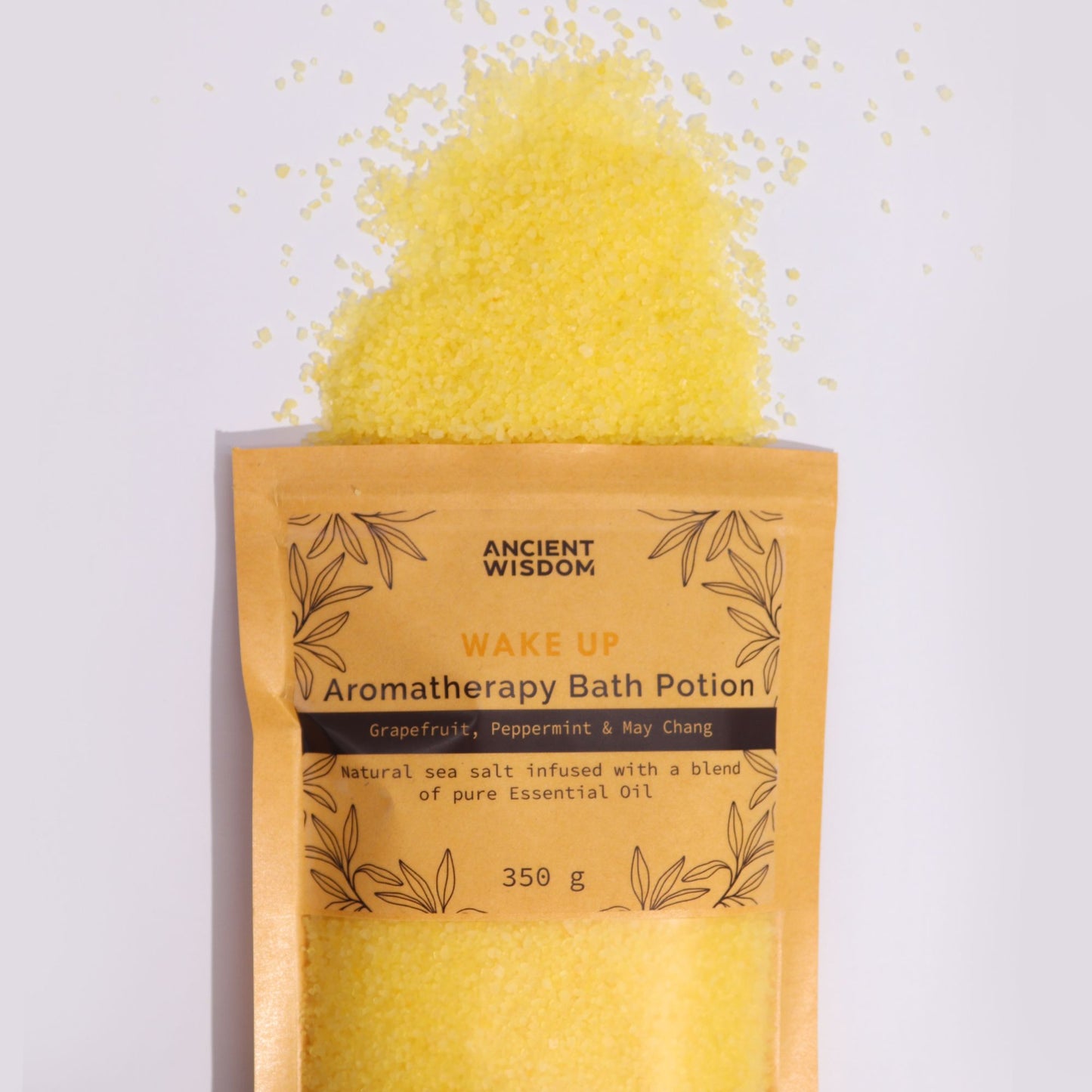 A rustic kraft paper bag containing 350g of vibrant yellow aromatherapy bath salts infused with energizing essential oils.