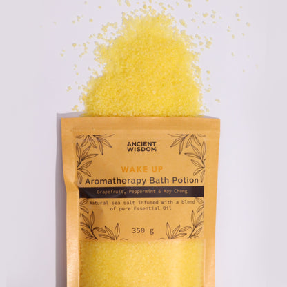 A rustic kraft paper bag containing 350g of vibrant yellow aromatherapy bath salts infused with energizing essential oils.