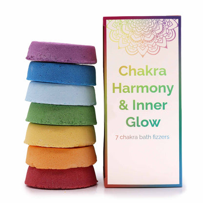 A large rectangular white gift box showcasing seven vibrant, rainbow-colored square bath fizzers in a beautiful row.